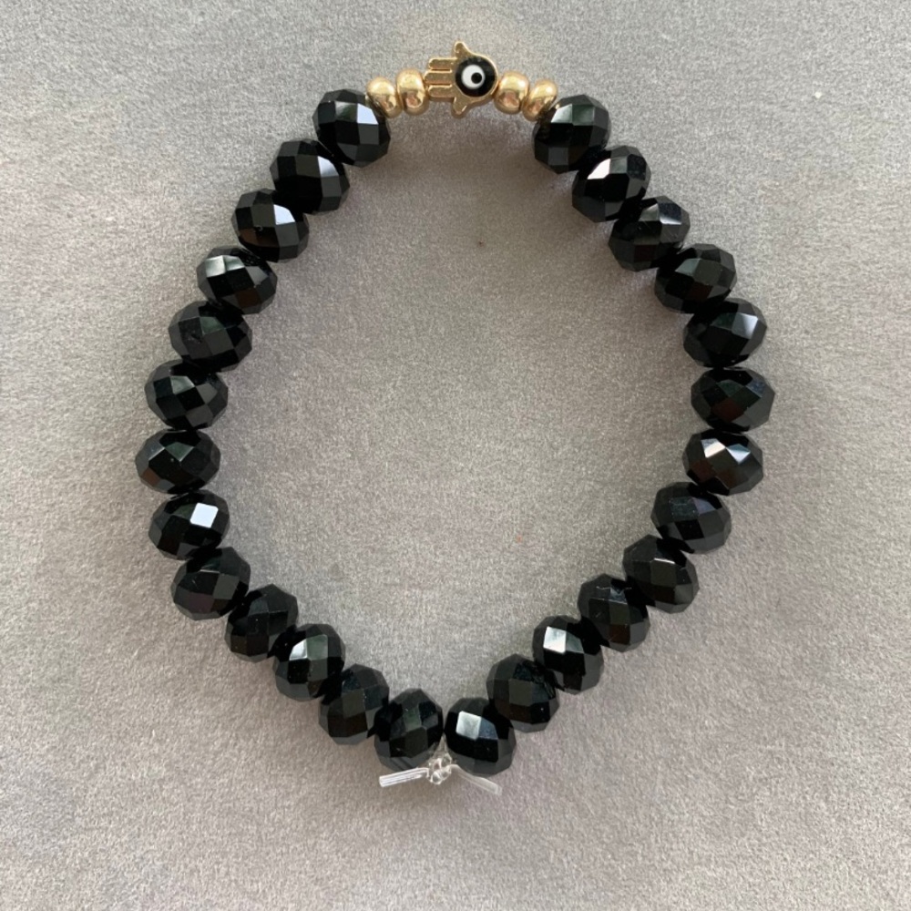 NWOT black crystal beaded evil eye elastic bracelet.